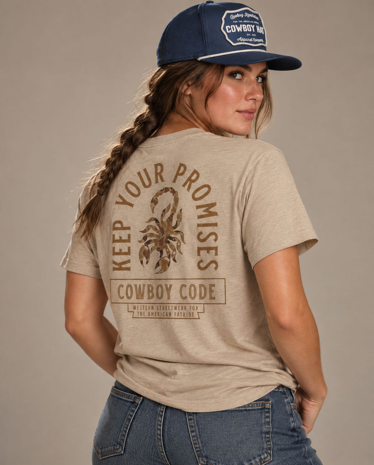 Female model in Cowboy Code #6 Keep Your Promises tee, Tan and Navy rope hat, Cowboy Revolution