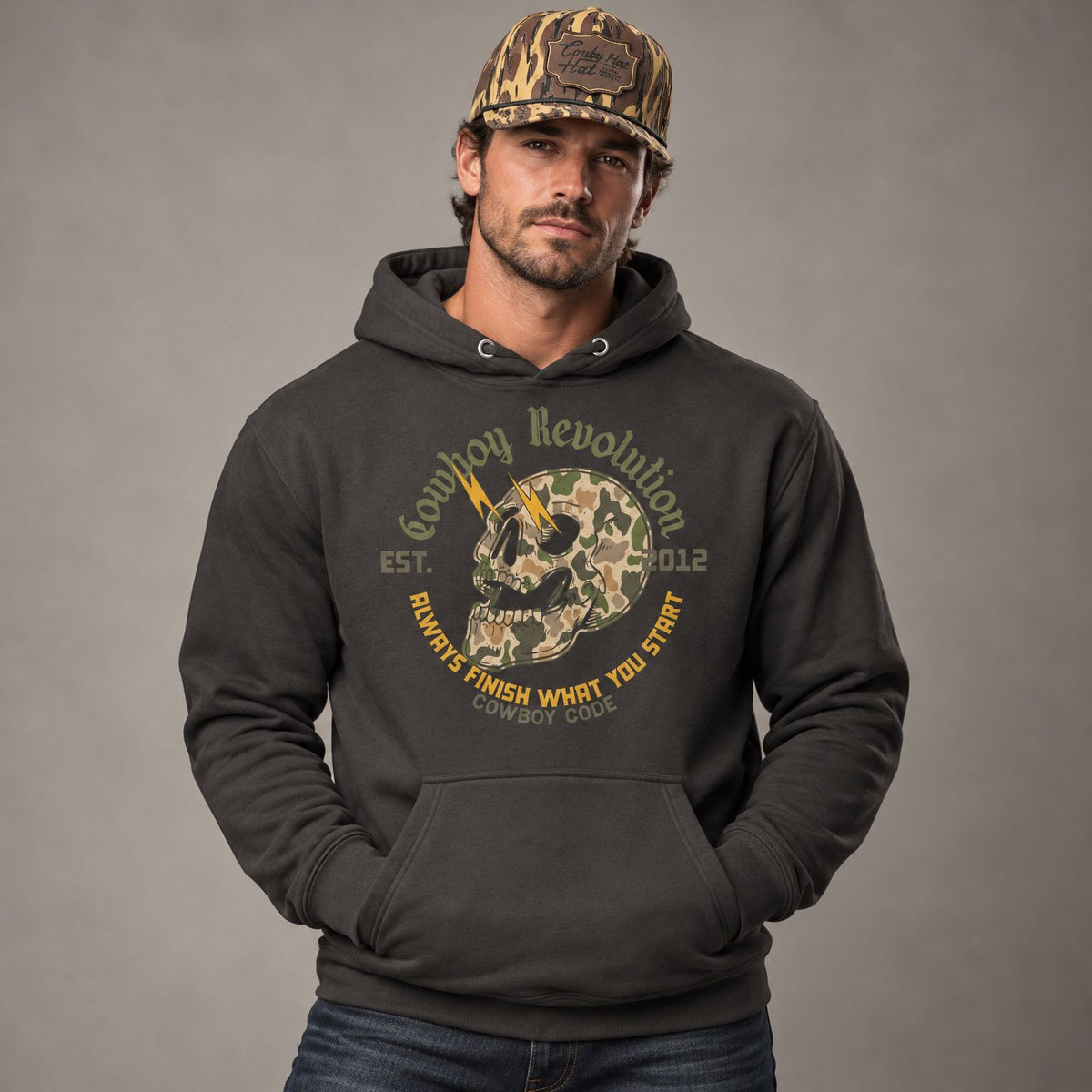 Cowboy Code #3 Finish hoodie worn by male model in studio, with Cowboy Revolution Atakapa Camo Swampland Patch Cowboy Hat