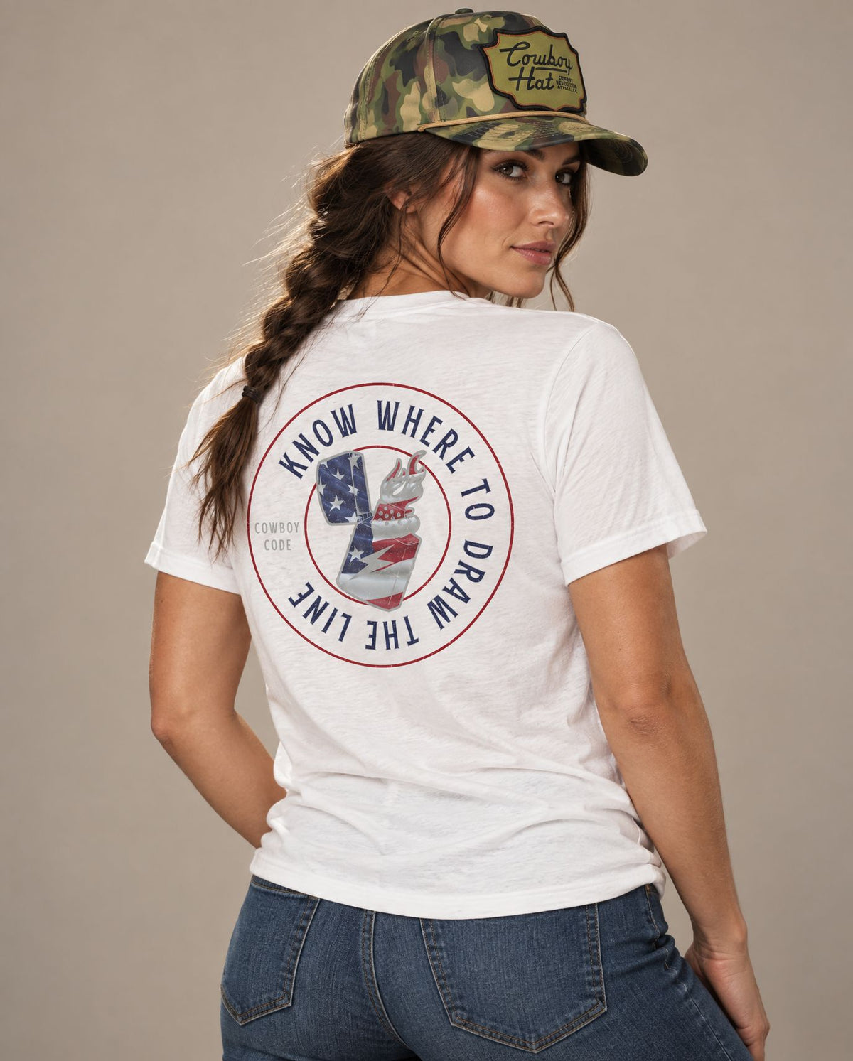 Female model in Cowboy Code #10 Know Where to Draw the Line tee, Solid White and Woodland Camo rope hat, Cowboy Revolution