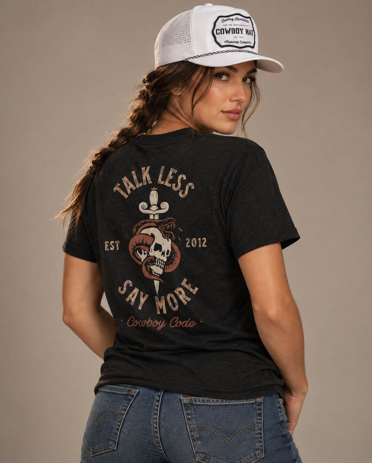 Female model in Cowboy Code #8 Talk Less, Say More tee, Solid Black and White rope hat, Cowboy Revolution