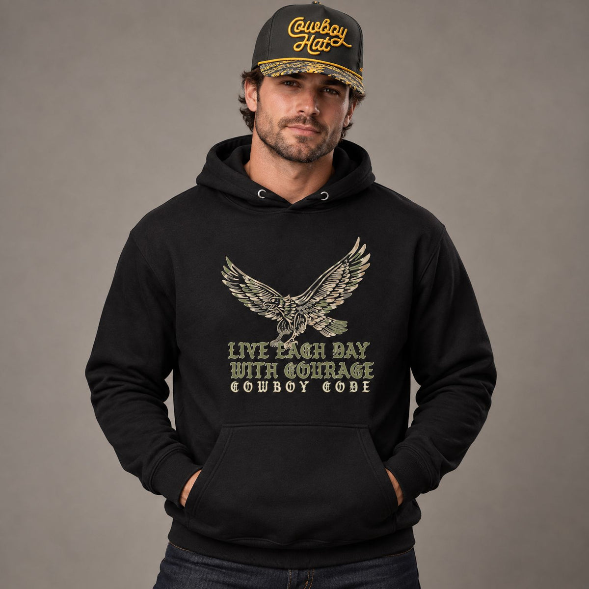 Cowboy Code #1 Courage hoodie worn by male model in studio, with Cowboy Revolution Viper NOLA Black Cowboy Hat