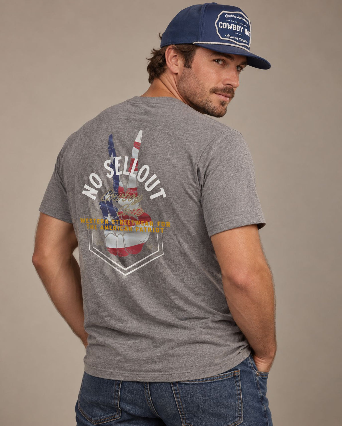 Male model in Cowboy Code #9 No Sellout tee, Grey and Navy rope hat, Cowboy Revolution